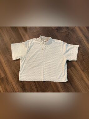 Nike White Textured Short Sleeve Top with Gold Swoosh Accent